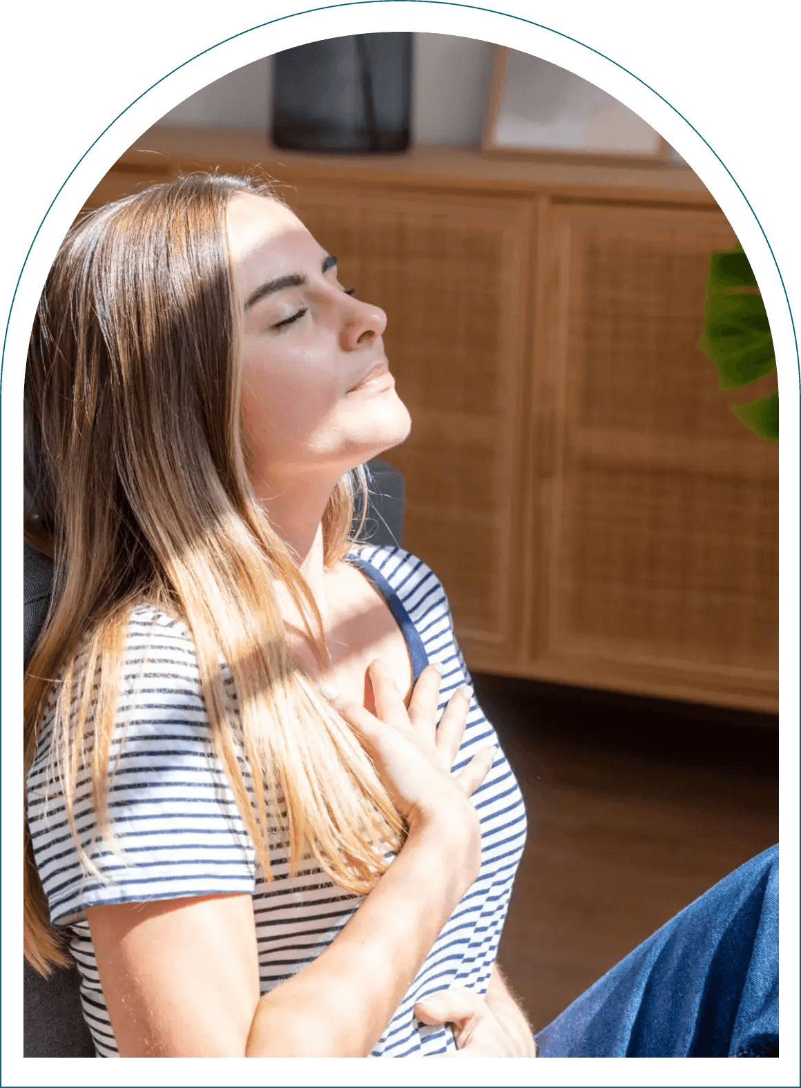 Woman relaxing with eyes closed indoors