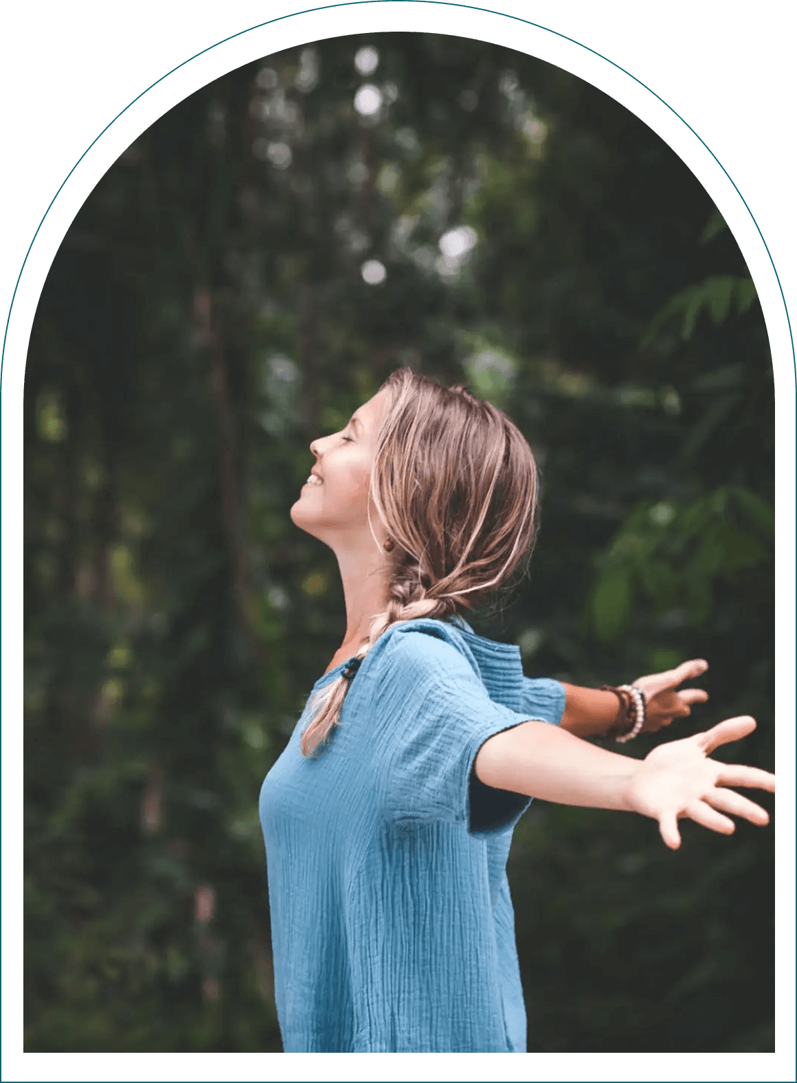 Woman enjoying nature with open arms