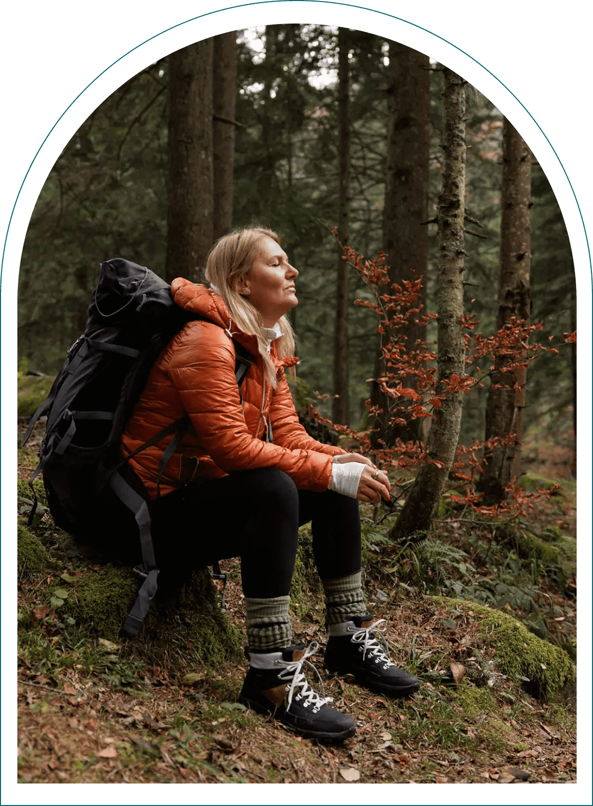 Woman resting during forest hike
