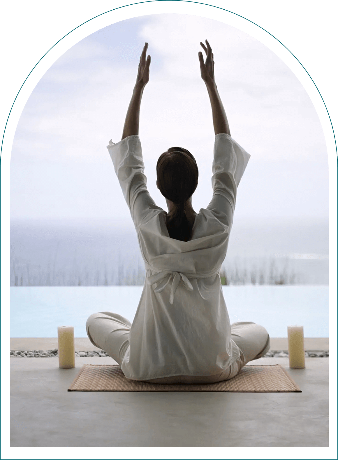Woman meditating by sea view