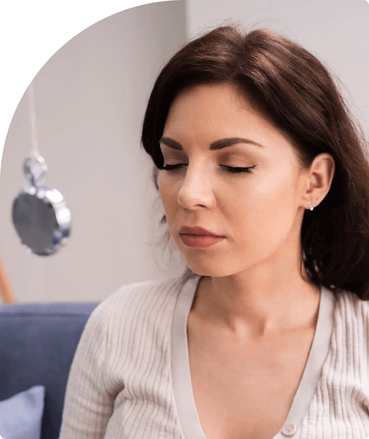Individual practicing mindfulness on sofa